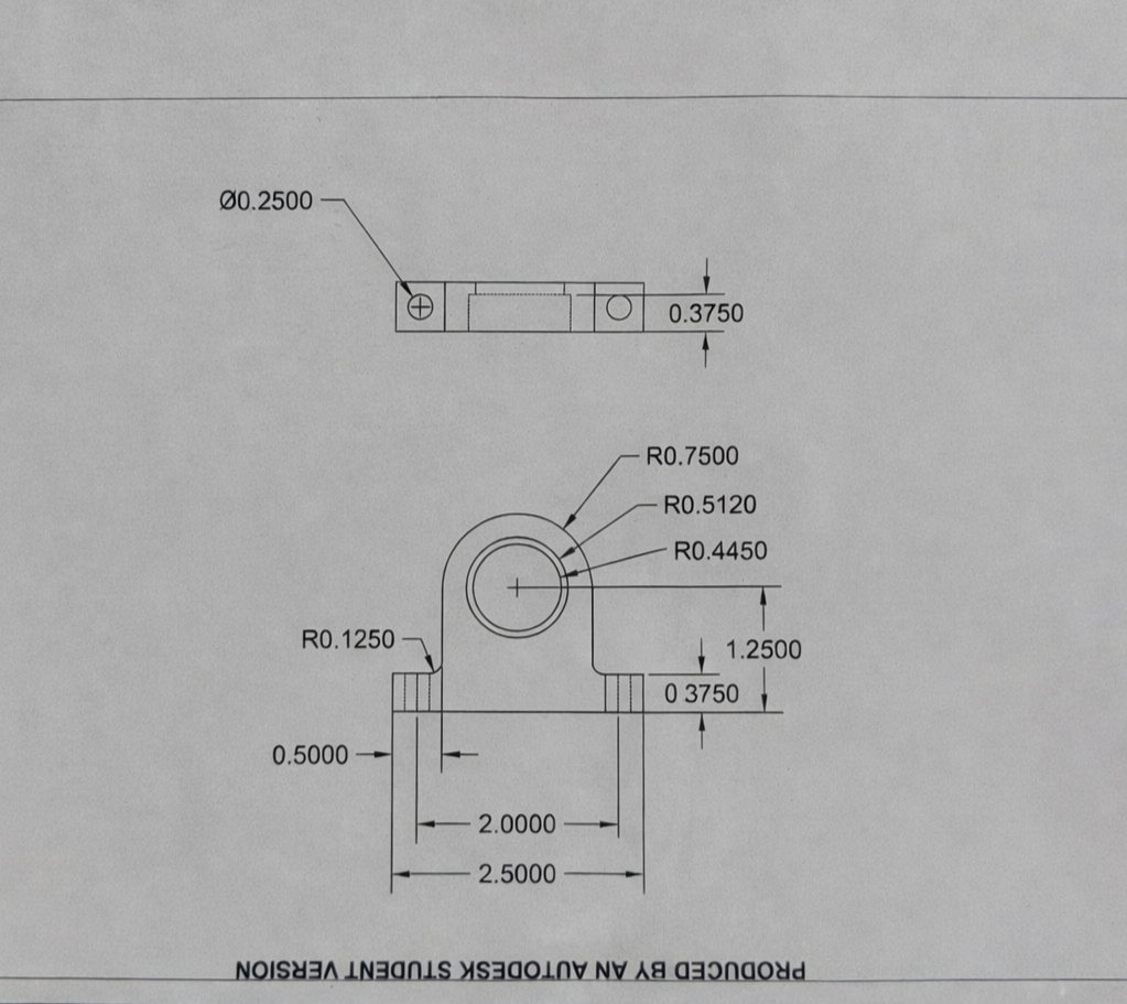 Engineering drawing on wooden table.png